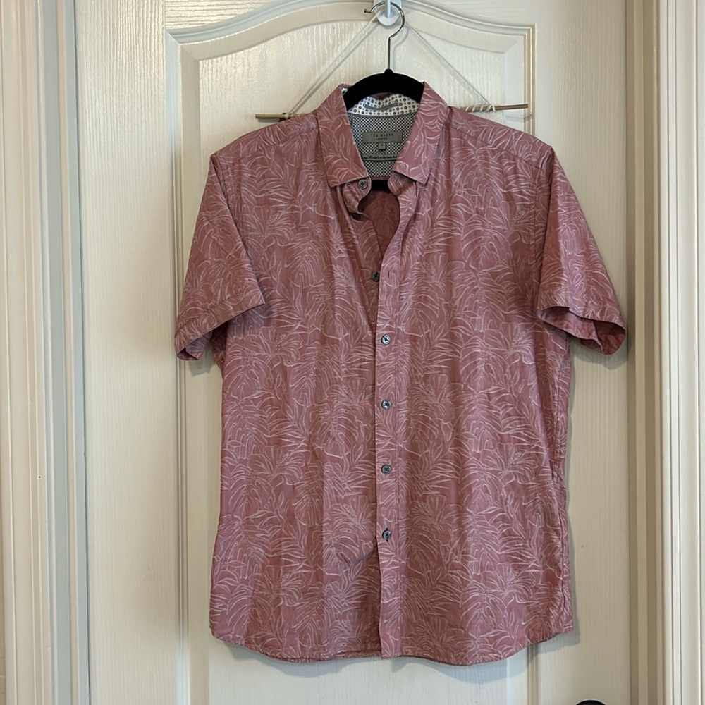 Ted Baker size 4 short sleeved shirt which equals a large in US sizing.